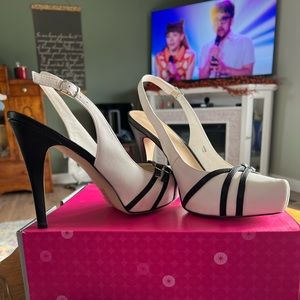 White with black, size 11 5” platform sling backs. Shoedazzle, NWOT. Never worn.